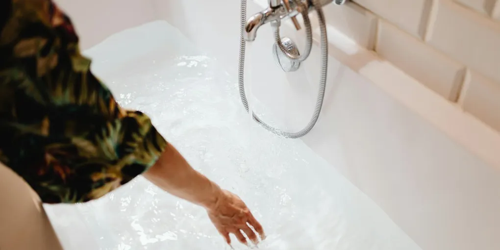How to Fix a Slow Draining Tub: Hair Clogs, Stoppers, and Drain Traps
